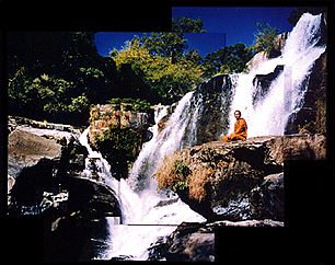 Monk & Waterfall, Thailand, Photo by Dennis Kohn